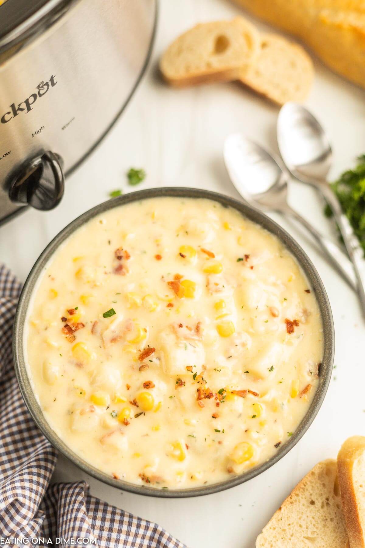 Corn Chowder in a black bowl with a spoon