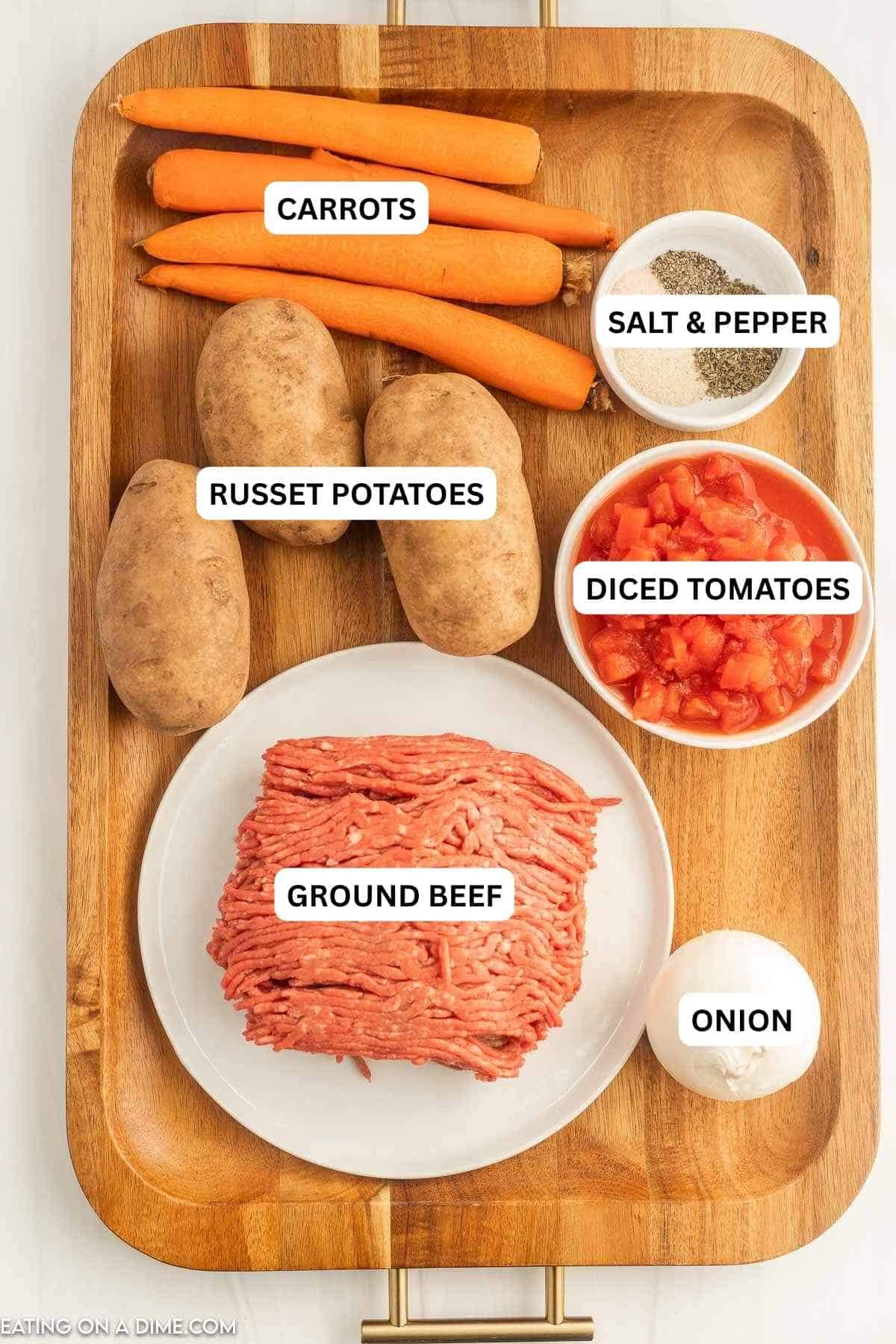Ingredients for recipe: carrots, salt, pepper, russet potatoes, diced tomatoes, ground beef and onion.