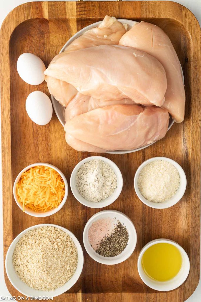 Ingredients needed - olive oil, chicken breast, salt and pepper, eggs, ranch seasoning mix, bread crumbs, cheddar cheese, parmesan cheese
