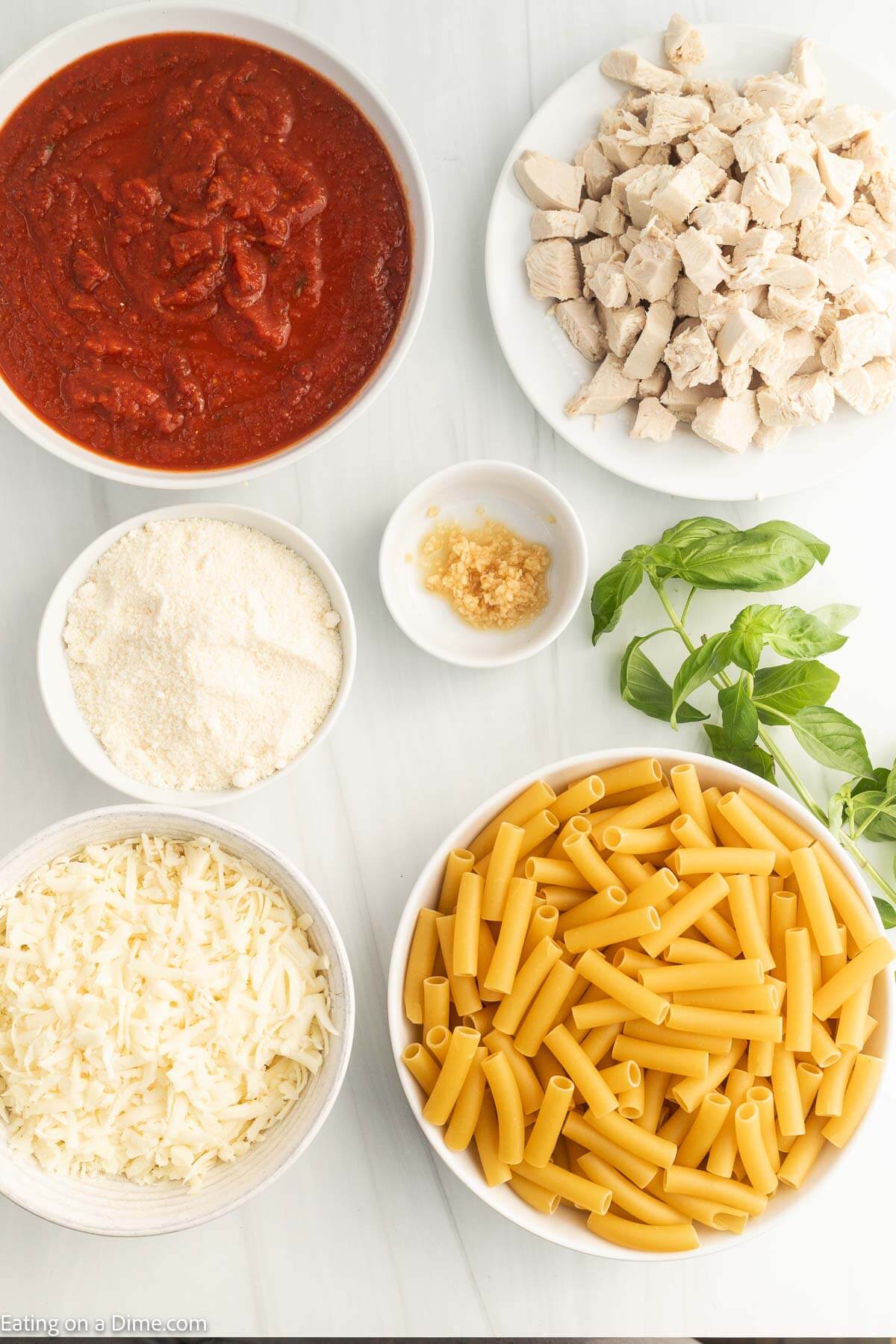 Ingredients needed - chicken, ziti noodles, garlic, pasta sauce, basil, parmesan cheese, mozzarella cheese