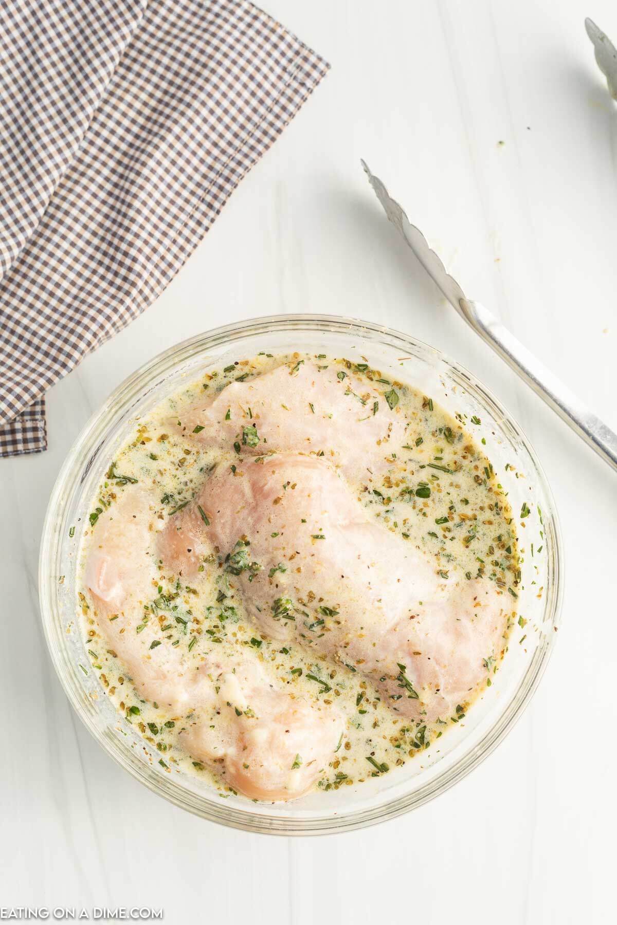 Marinade in bowl with chicken. 