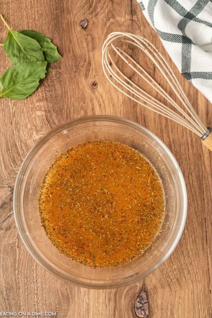 Combining the ingredients to make the sauce in a bowl