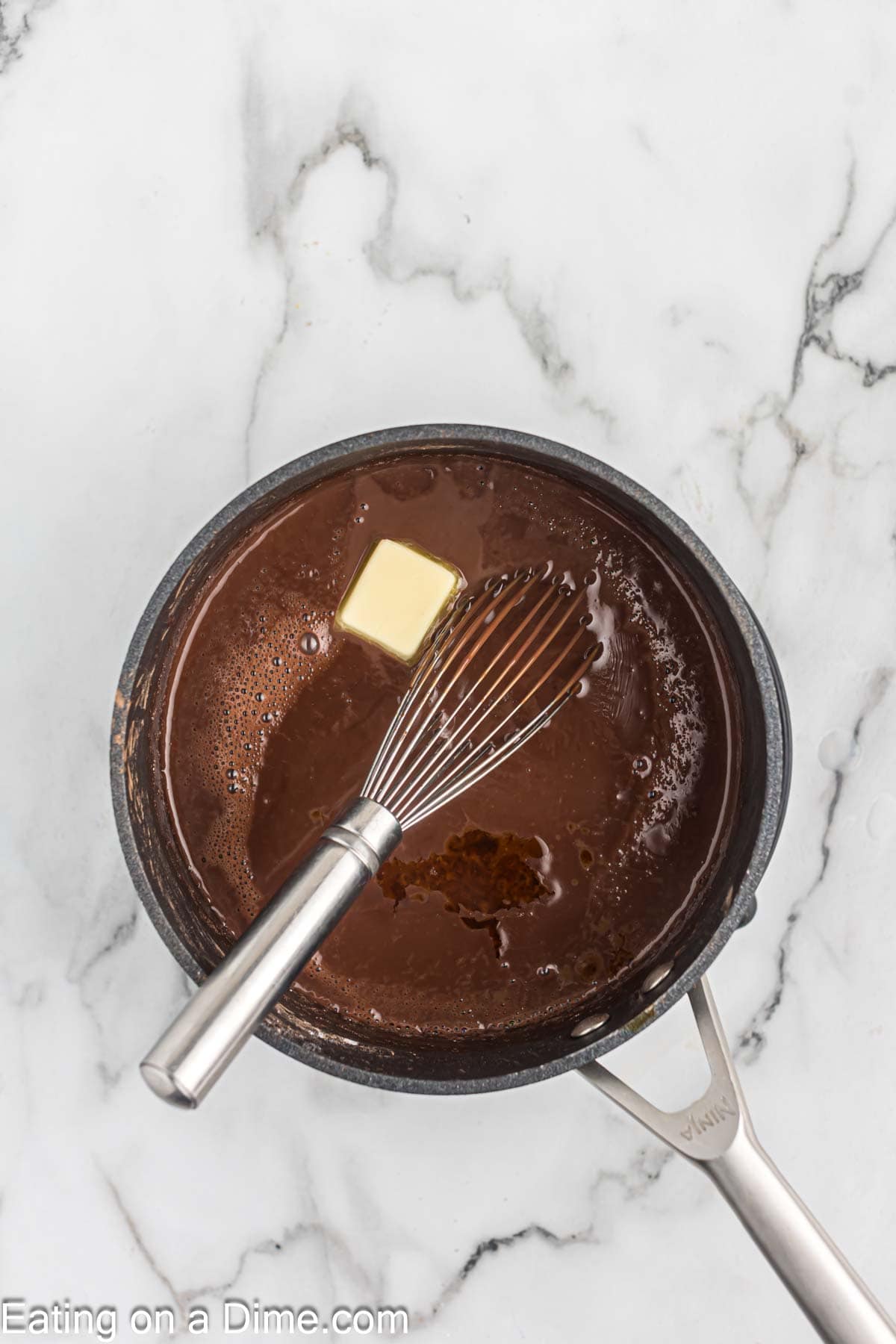 Adding in butter and vanilla into the chocolate mixture in saucepan