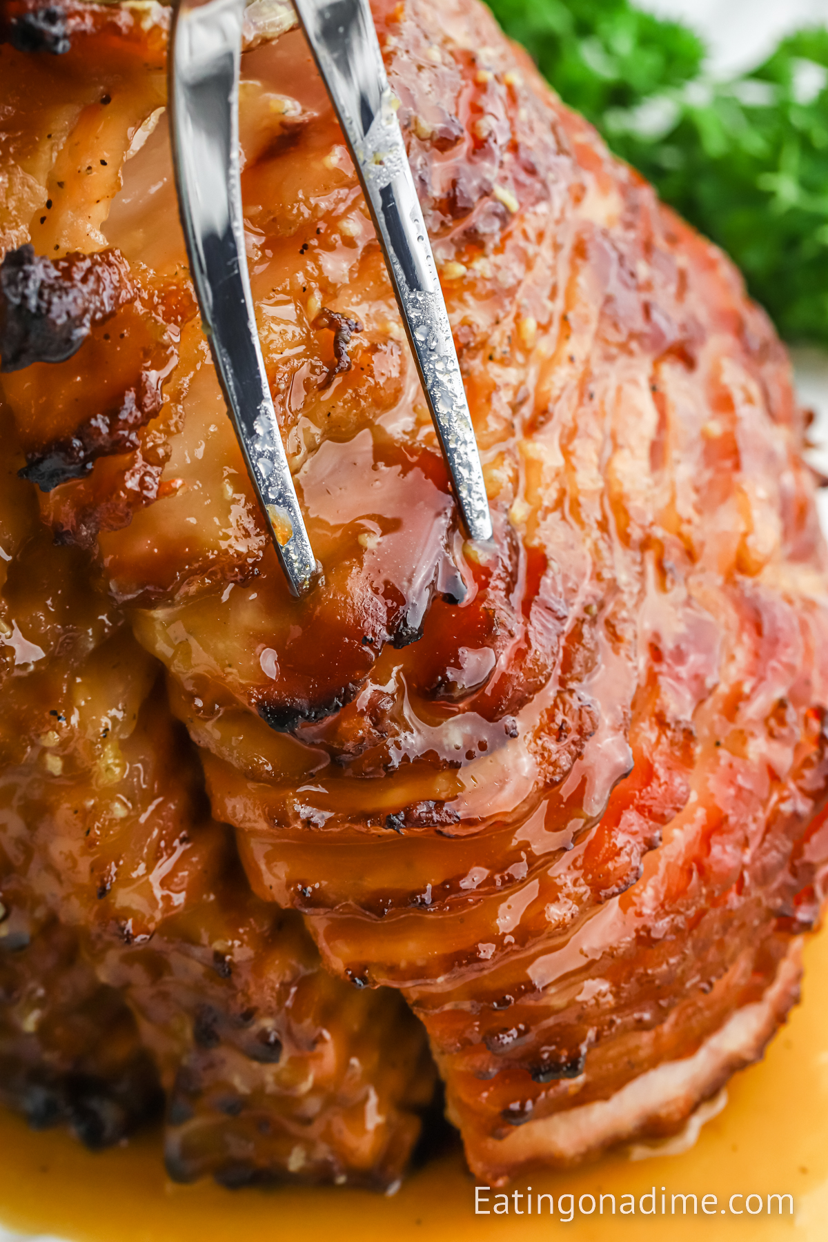 Slice ham on a plate with the glaze on the top
