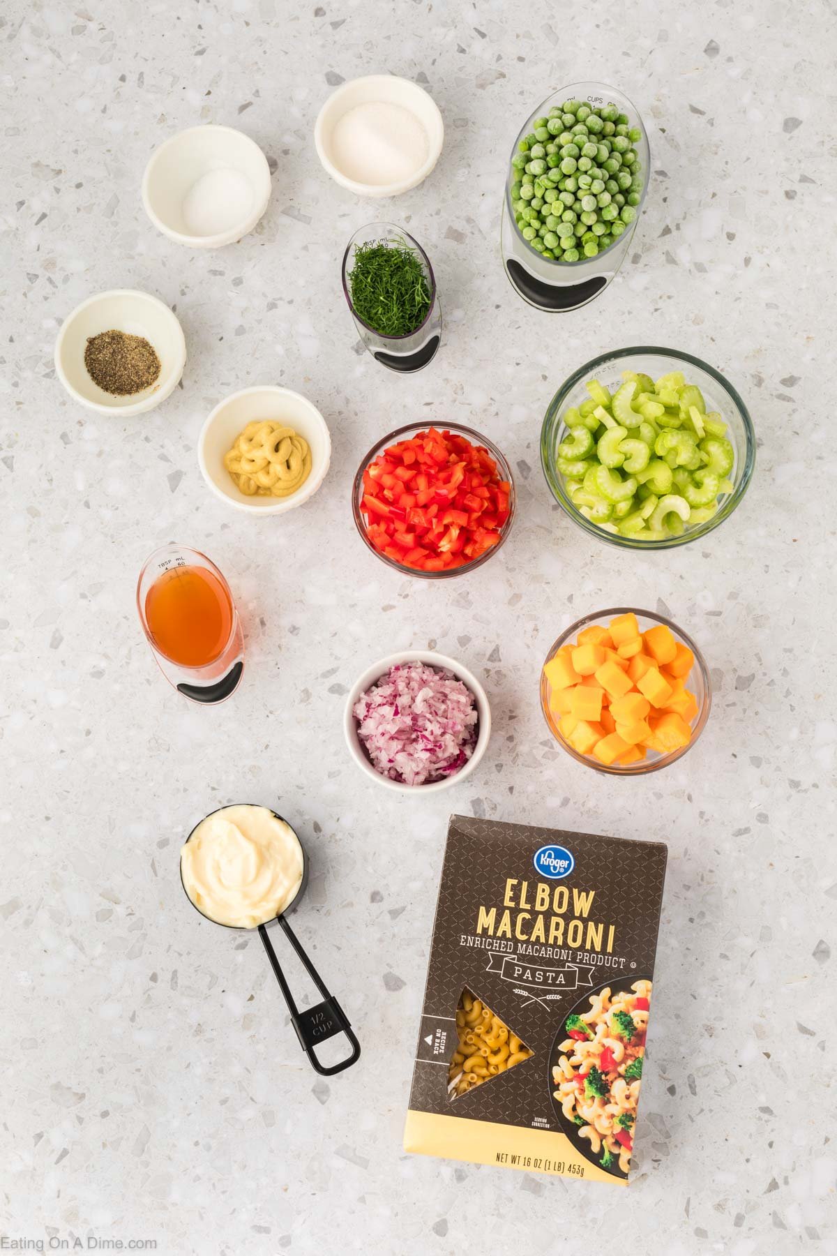 This Easy Macaroni Salad recipe is the perfect side dish to bring to Summer BBQ's, parties and more! Easy macaroni salad is loaded with veggies, cheese and more. You will love the creamy dressing in Macaroni salad recipe. Try this Pasta salad with mayo. Everyone will love this simple Elbow macaroni salad! Ingredients to make this Macaroni Salad