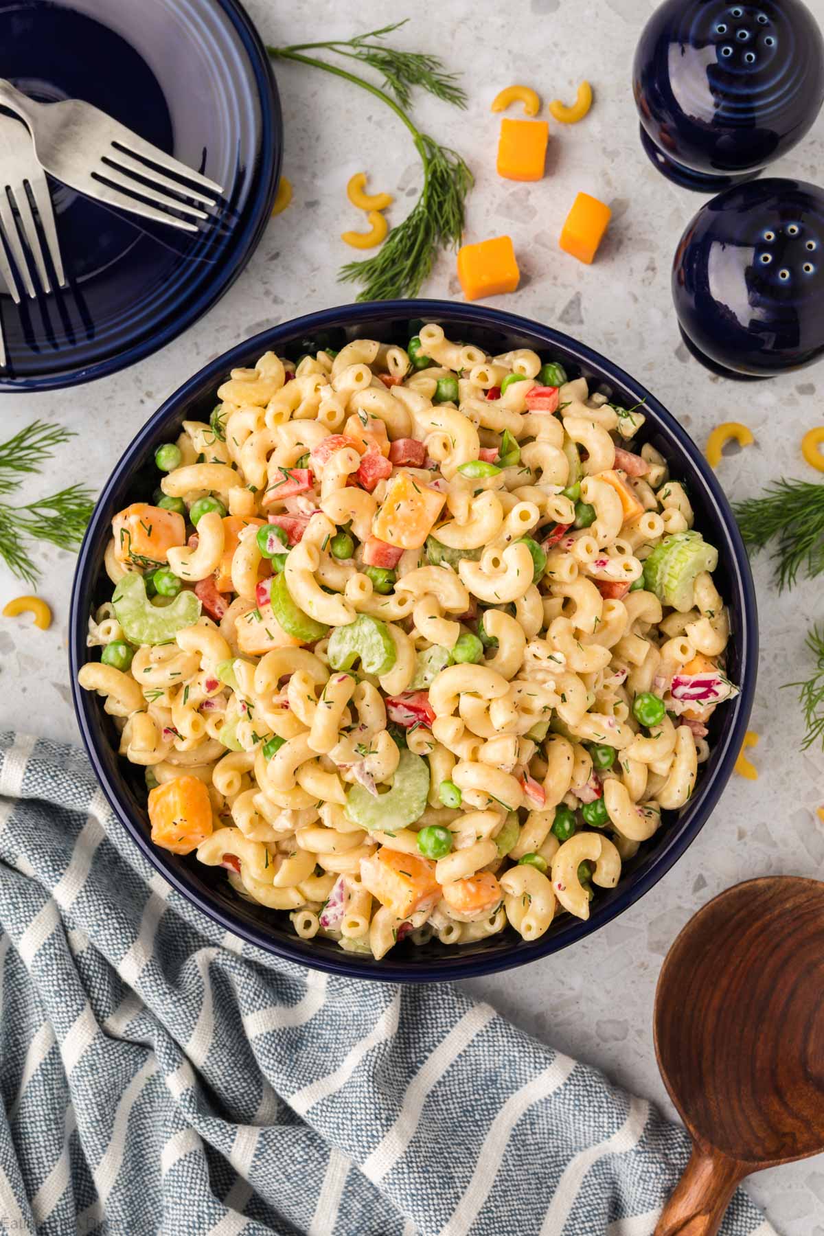 This Easy Macaroni Salad recipe is the perfect side dish to bring to Summer BBQ's, parties and more! Easy macaroni salad is loaded with veggies, cheese and more. You will love the creamy dressing in Macaroni salad recipe. Try this Pasta salad with mayo. Everyone will love this simple Elbow macaroni salad!