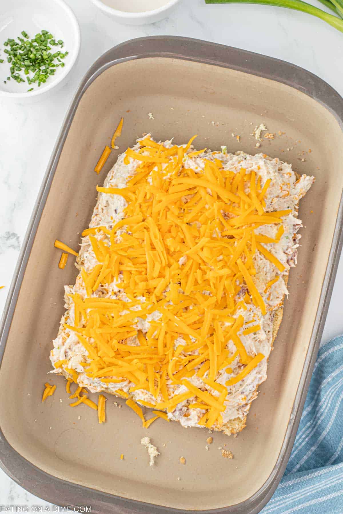 Spread the chicken mixture on the bottom rolls in a baking dish and topped with shredded cheese