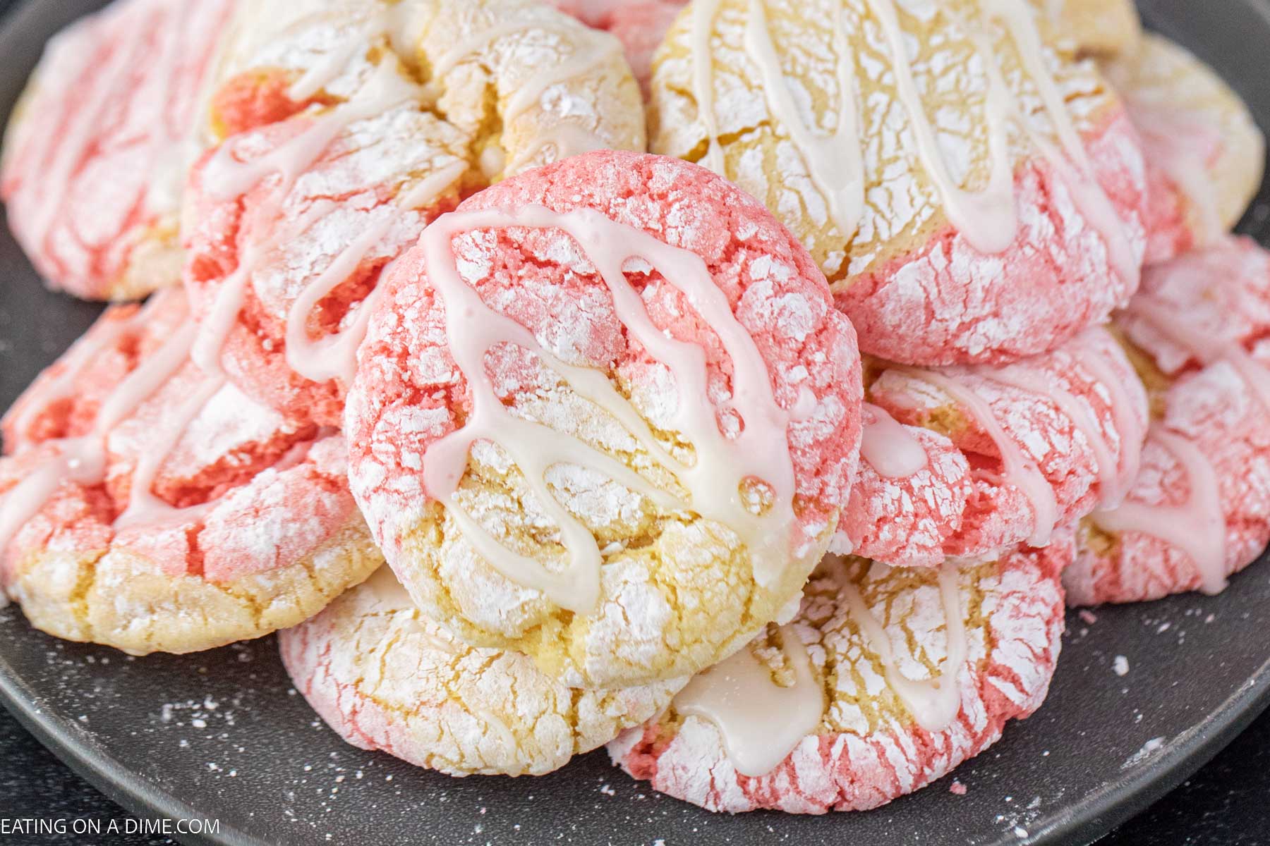 Strawberry and Lemonade cake mix cookies stacked on a plate
