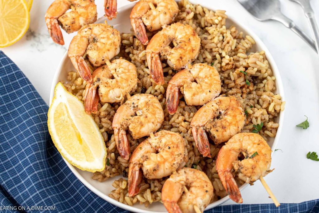 Texas Roadhouse Grilled Shrimp on a plate with rice. 