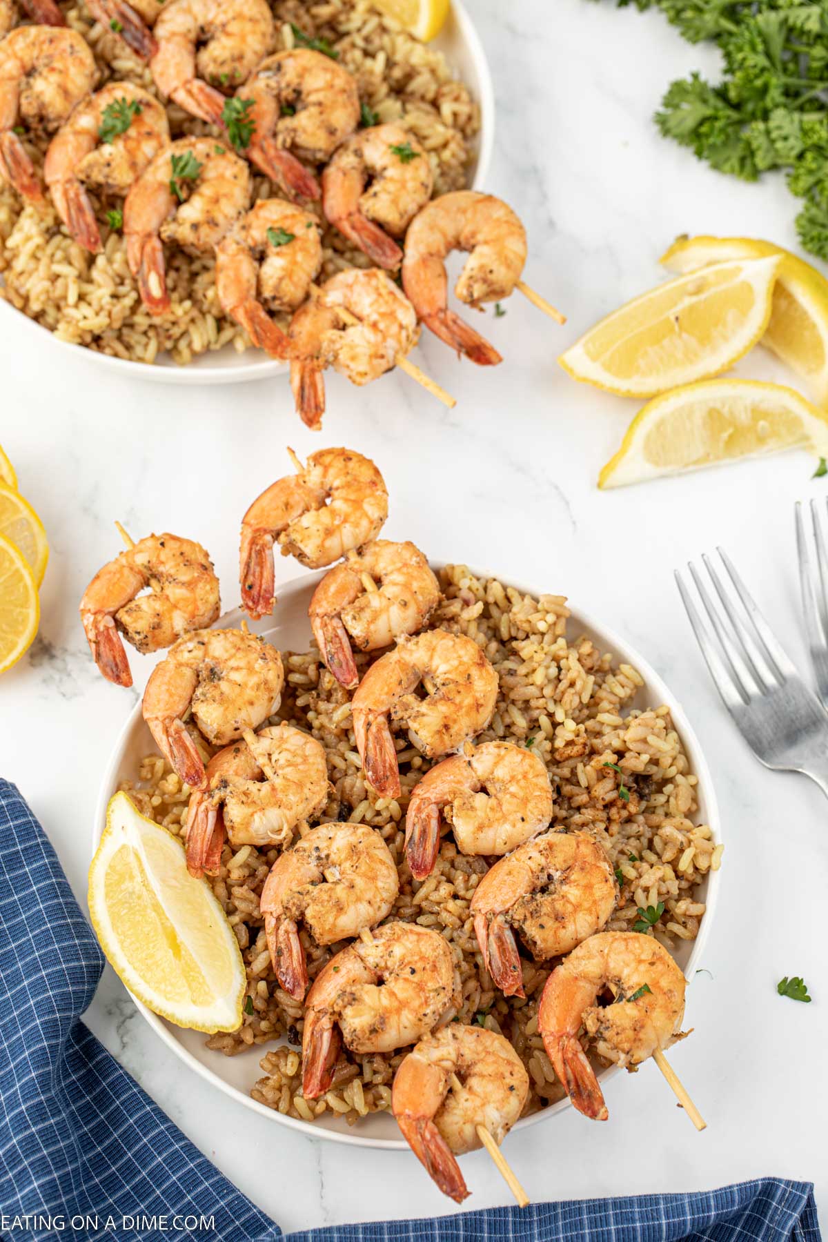 Texas Roadhouse Grilled Shrimp on a plate with rice. 