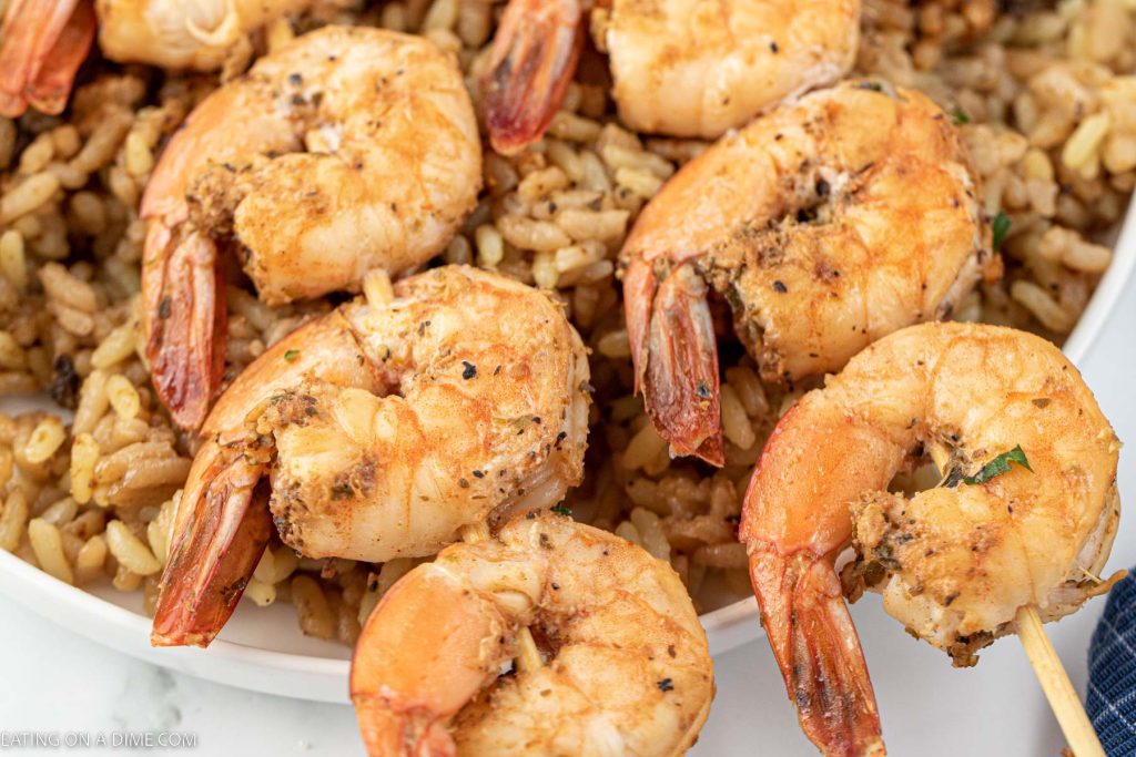 Texas Roadhouse Grilled Shrimp on a plate with rice. 