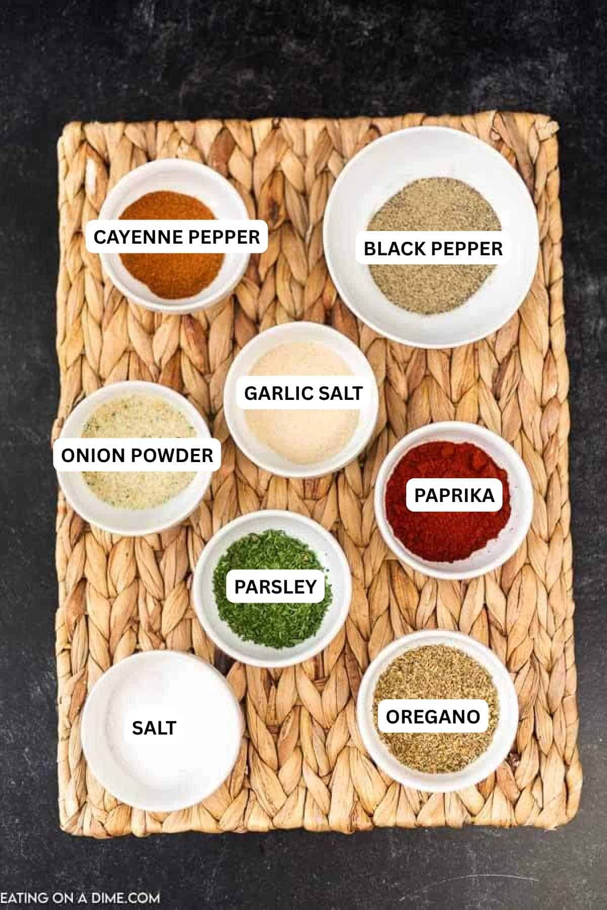 Ingredients for recipe: cayenne pepper, black pepper, garlic salt, onion powder, paprika, parsley, salt and oregano.