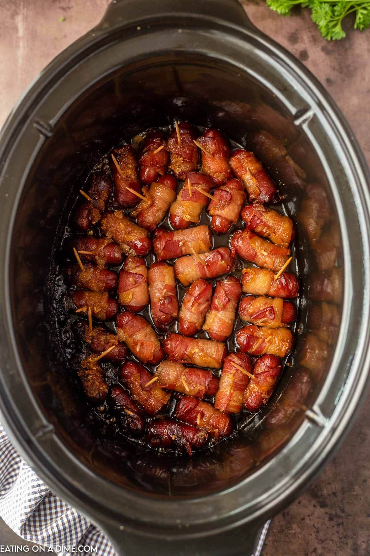 Bacon wrapped lil smokies in the slow cooker
