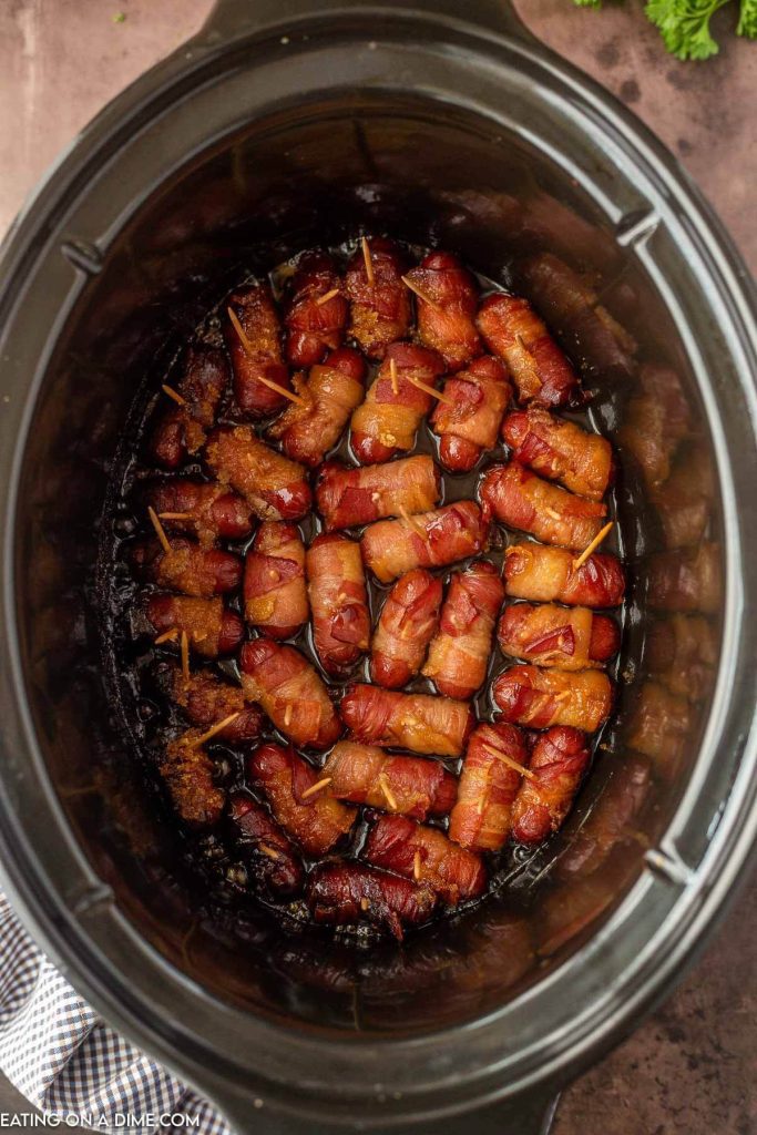Bacon wrapped lil smokies in the slow cooker
