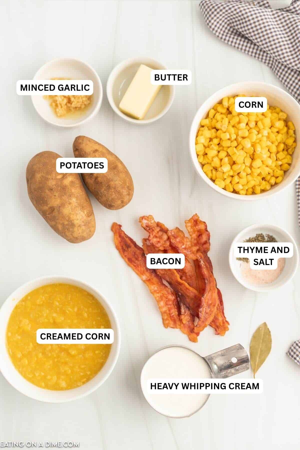 Ingredients for recipe: garlic, butter, corn, potatoes, creamed corn, bacon, thyme, salt, creamed corn and heavy whipping cream.