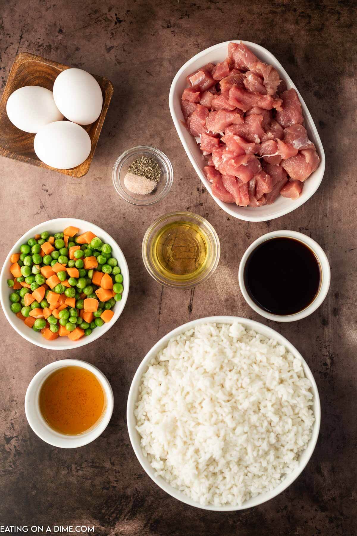 Ingredients needed - pork tenderloin, sesame oil, vegetable oil, cooked rice, soy sauce, salt and pepper, frozen veggies, egg, green onions