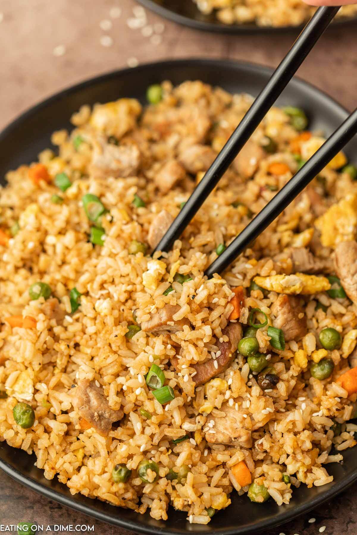 Pork Fried Rice on a plate with chopsticks
