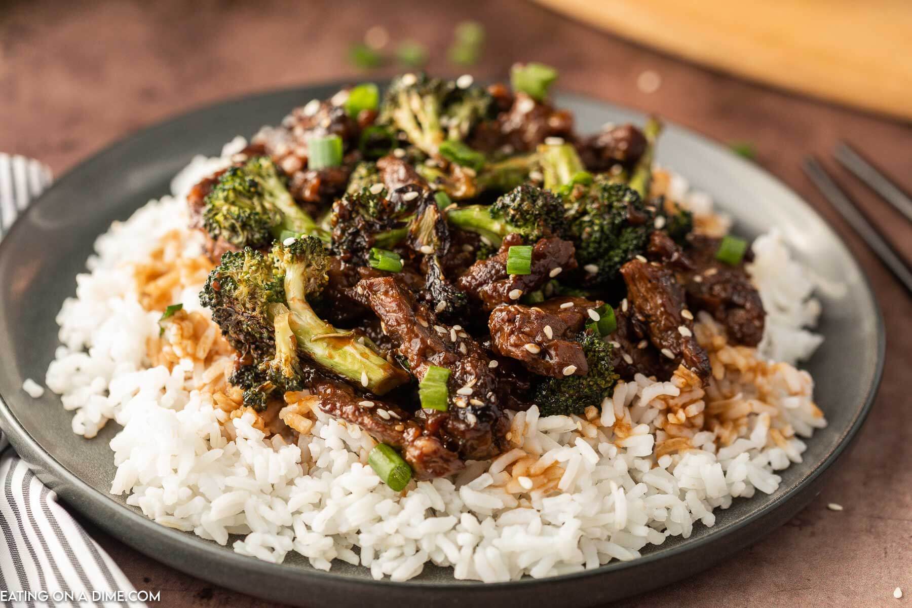 Beef and Broccoli over white rice on a plate