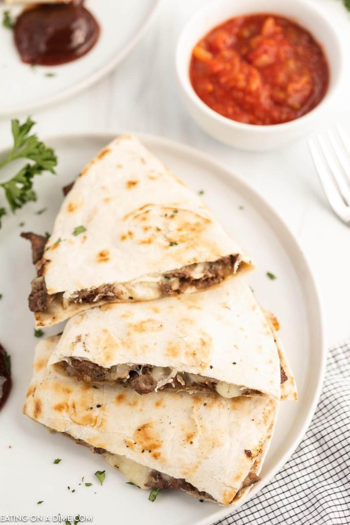 steak and cheese quesadilla sliced with salsa