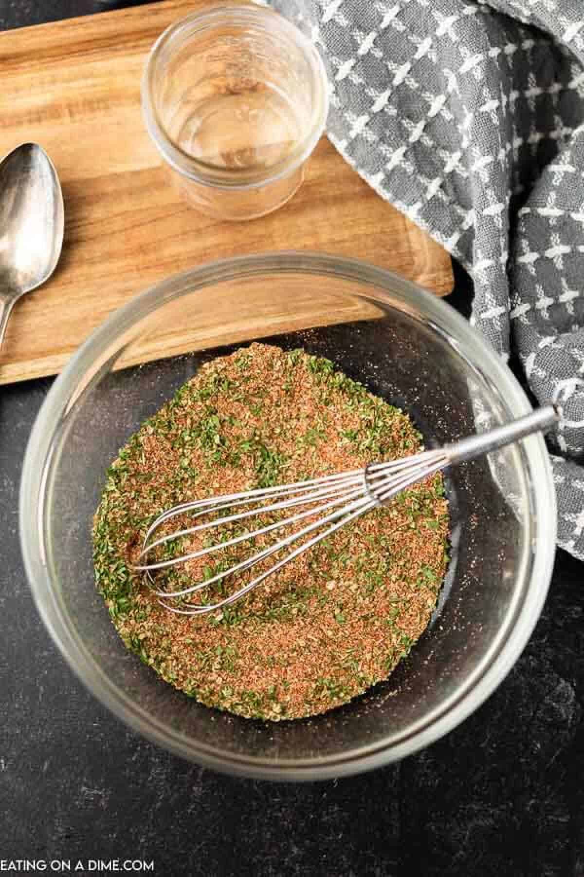 Combining ingredients in a bowl with a whisk