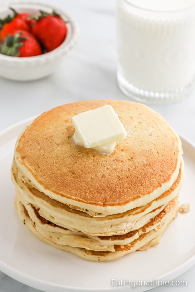 Stack of pancakes with butter on top
