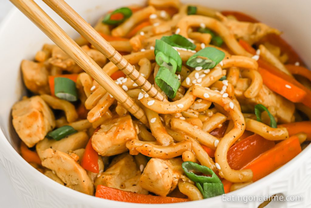 Hoisin Chicken with Noodles and sauce in a bowl with chopsticks