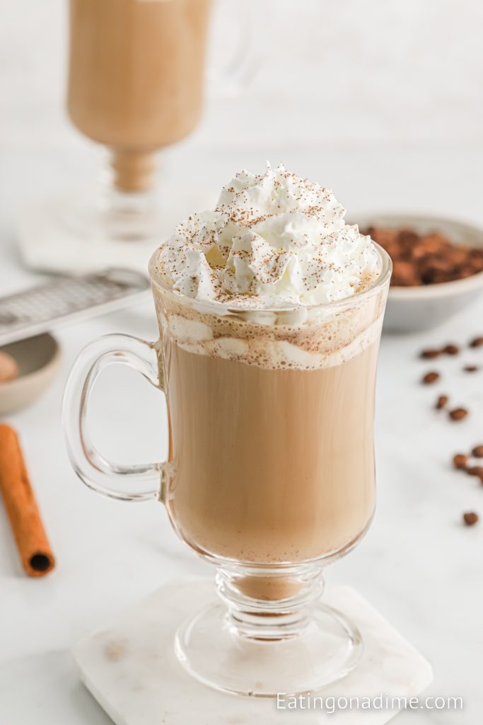Cinnamon Dolce Latte topped with whipped cream, cinnamon and a cinnamon stick