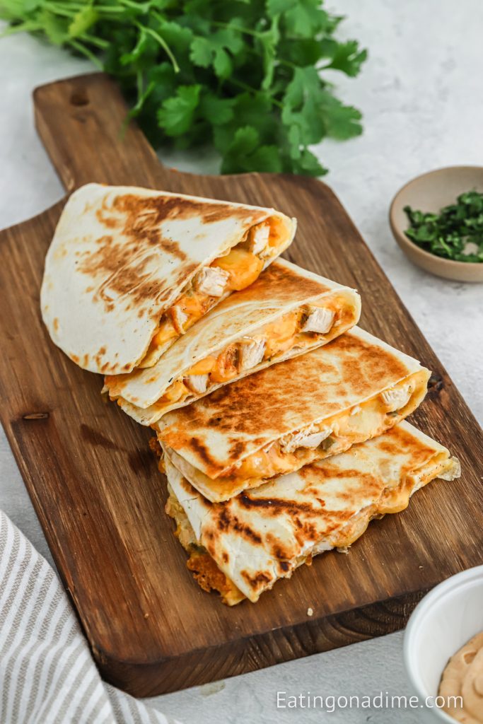 Chicken quesadilla stacked on a cutting board