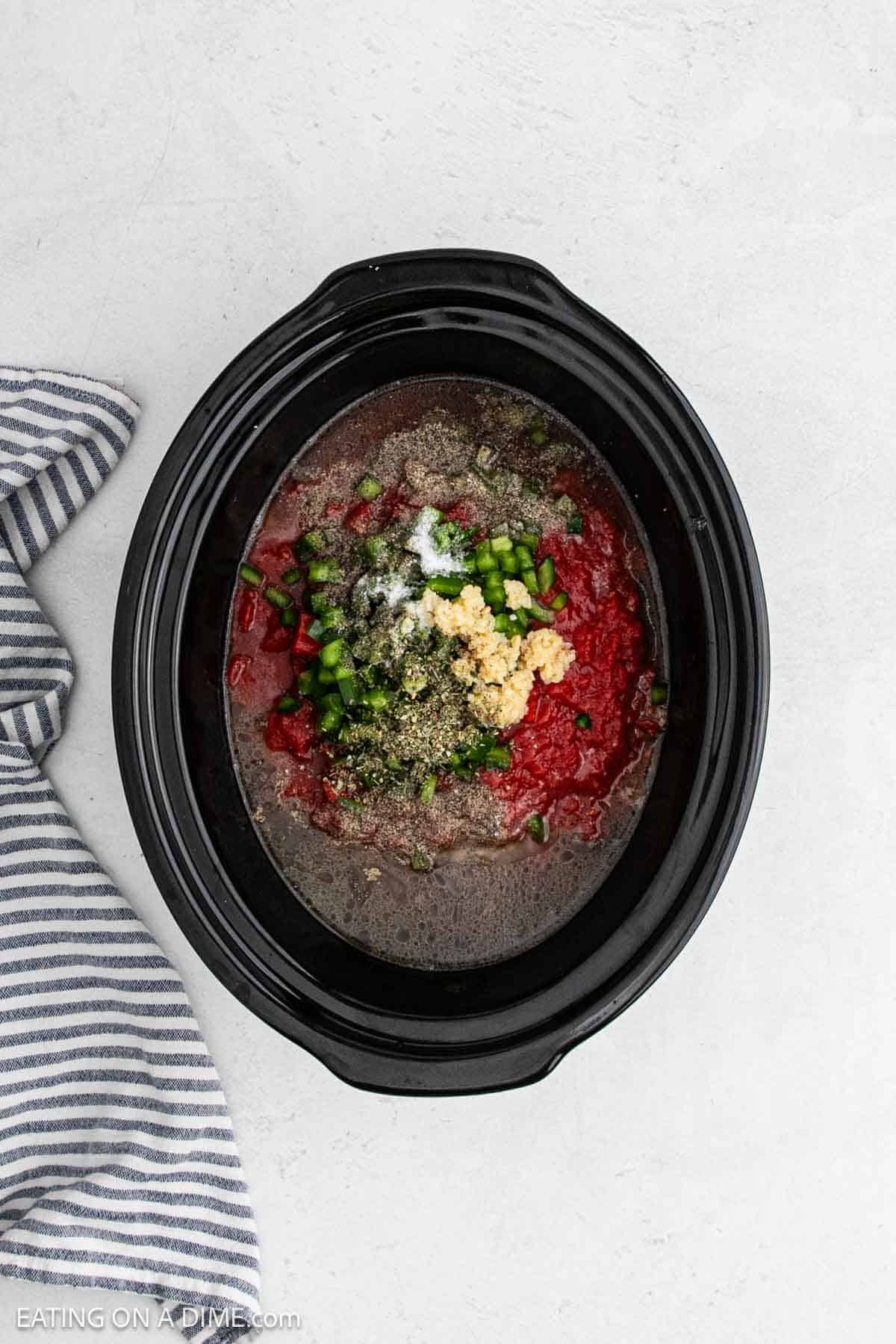 Ingredients added to the slow cooker.