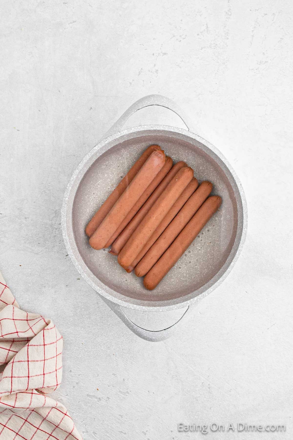 Hot dogs in a large pot of water