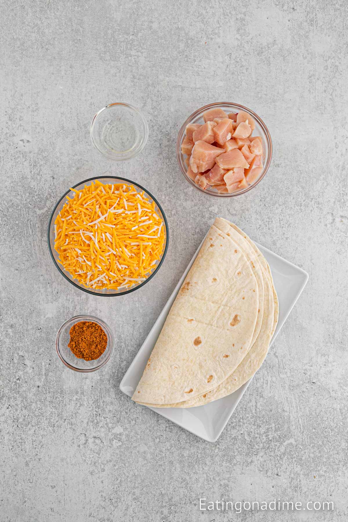 Ingredients needed - chicken, oil, taco seasoning, cheese, tortilla