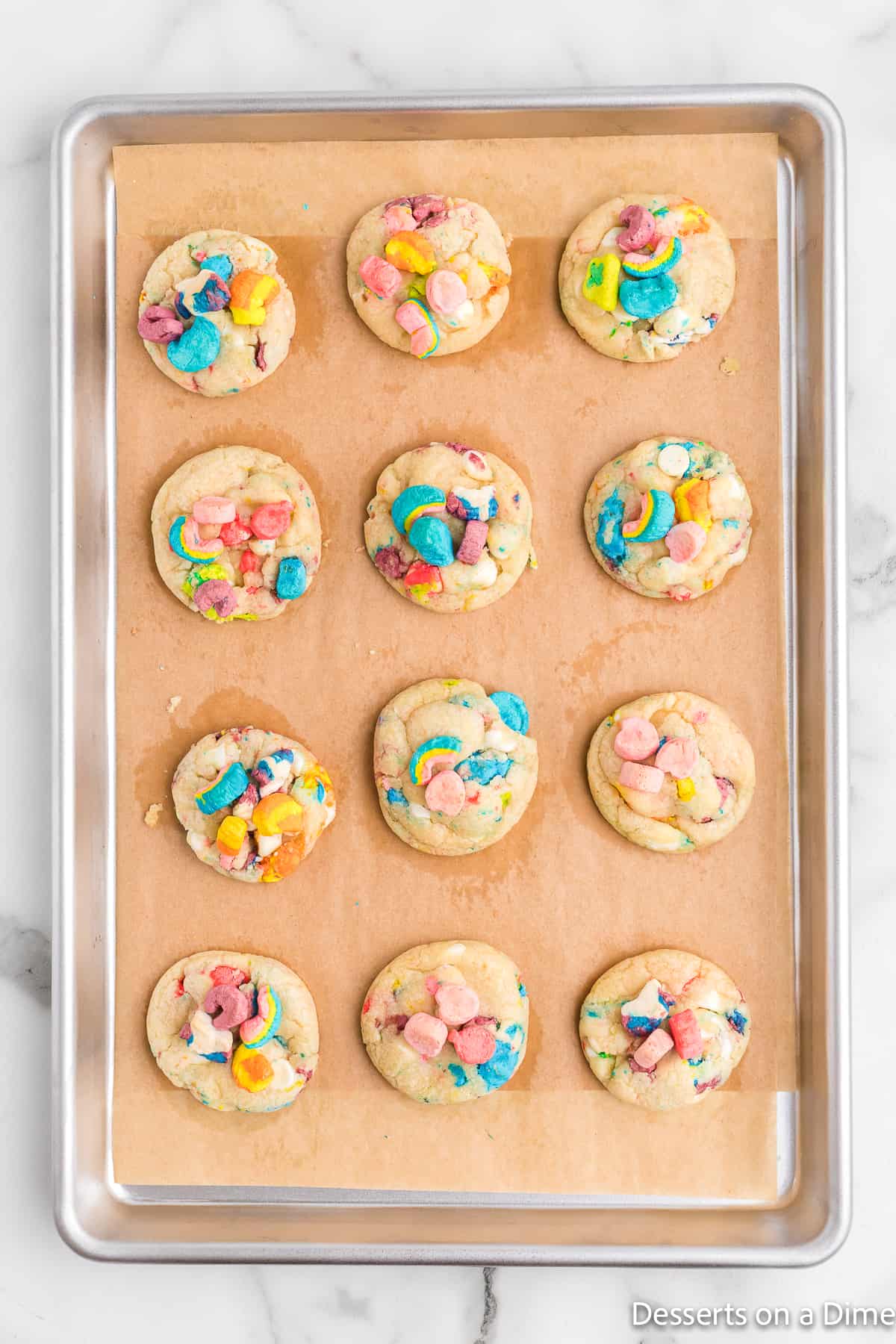 Baked Lucky Charm cookies on a baking sheet