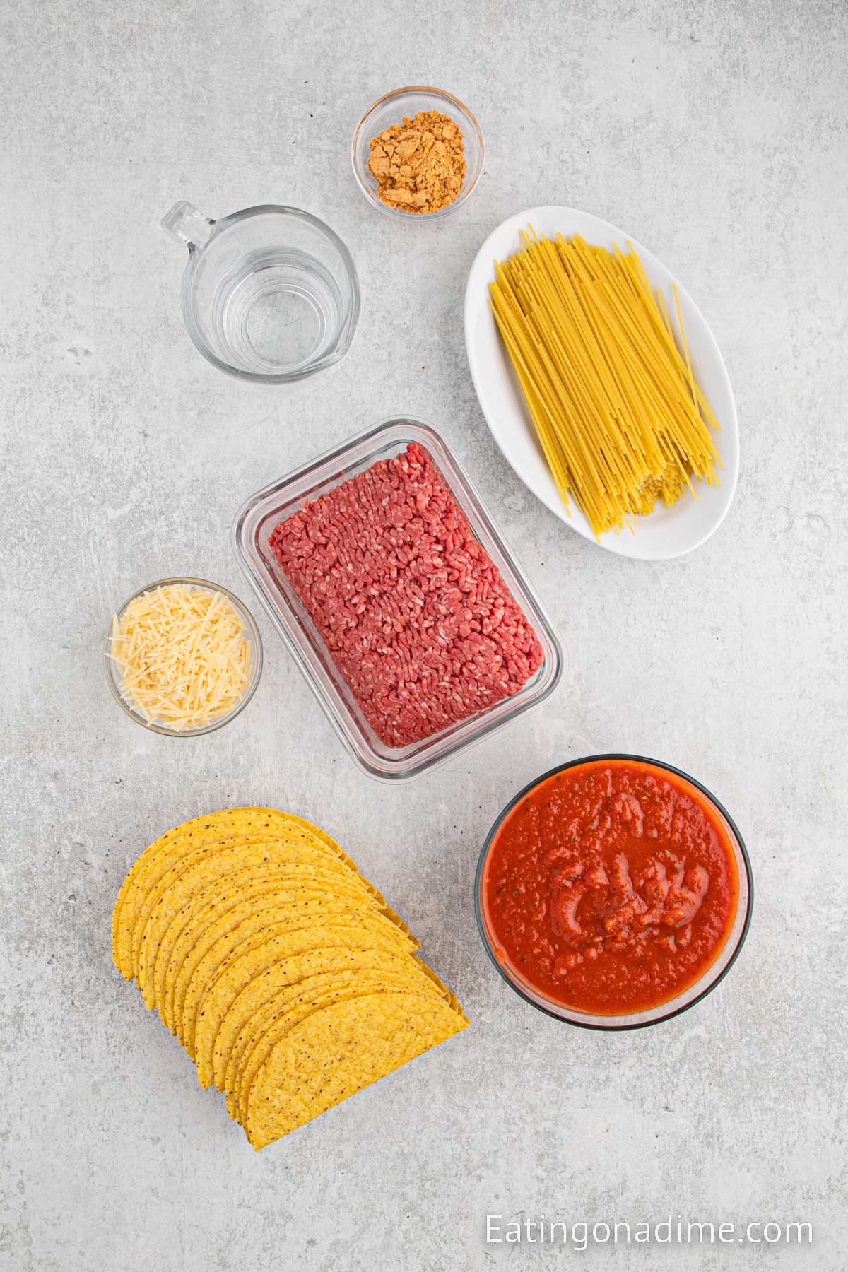 Ingredients needed - noodles, beef, taco seasoning, sauce, taco shells, parmesan cheese
