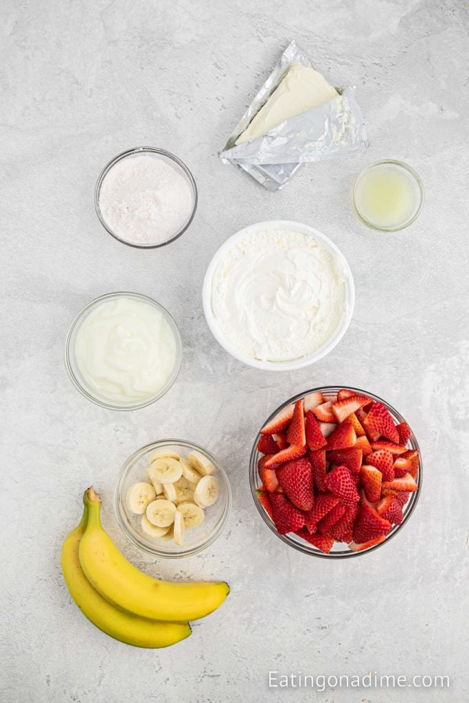 Ingredients needed - cream cheese, instant pudding mix, vanilla yogurt, whipped topping, fresh strawberries, bananas, lemon juice
