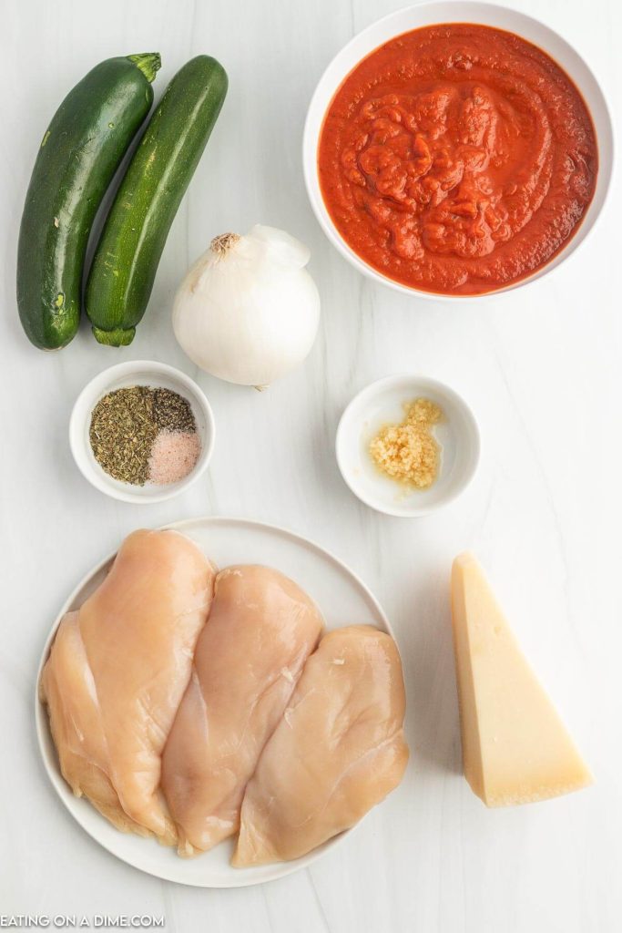 Ingredients needed - chicken, onion, marinara sauce, italian seasoning, zucchini, minced garlic, salt and pepper, Parmesan Cheese