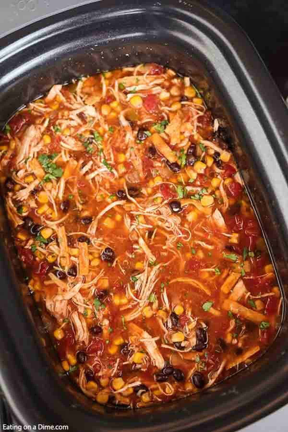 Crockpot Chicken Tortilla Soup Recipe is the best comfort food and it is so simple to make in the slow cooker. This recipe can feed a crowd!