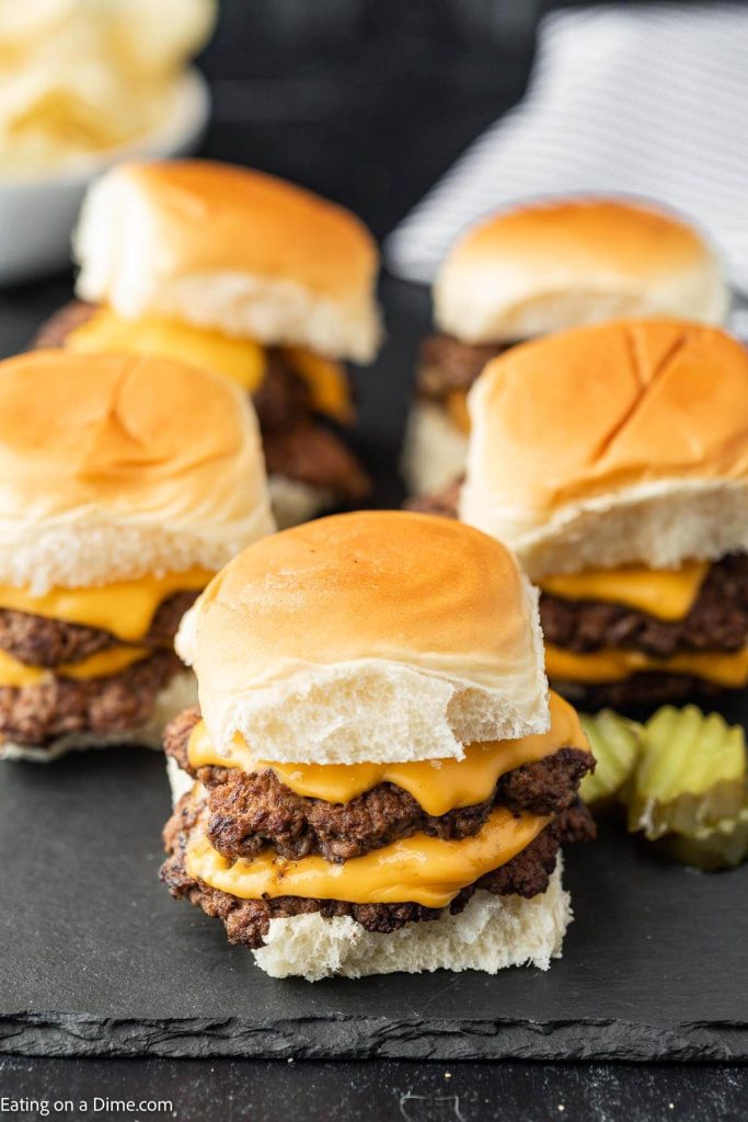 Smash burger sliders with toppings. 
