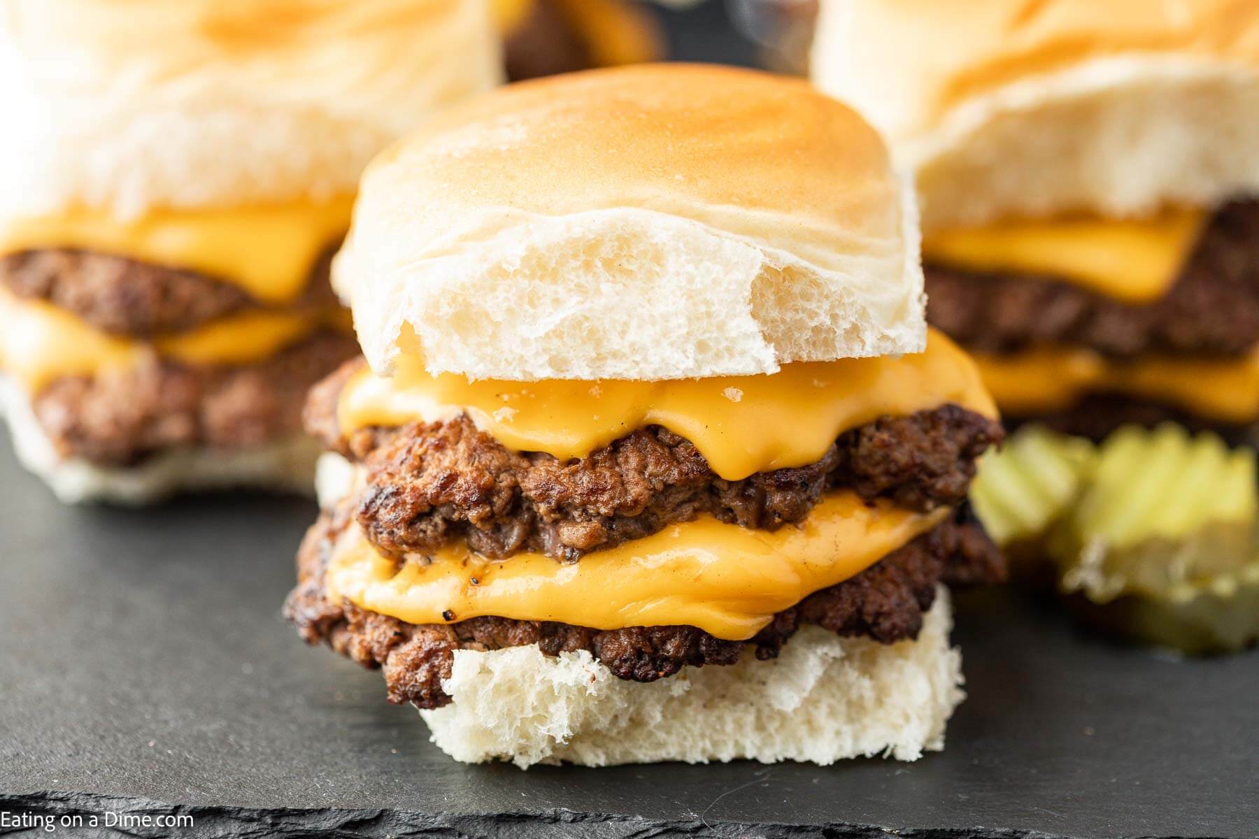 Smash burger sliders with toppings. 
