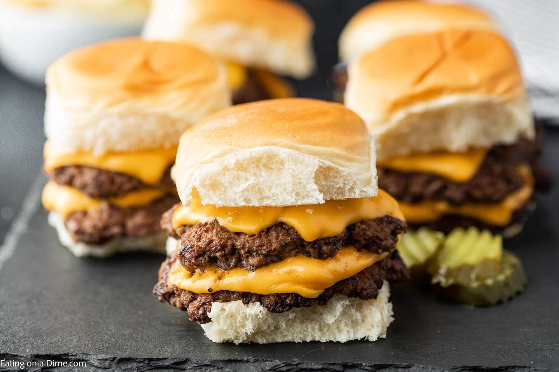 Smash burger sliders with toppings. 
