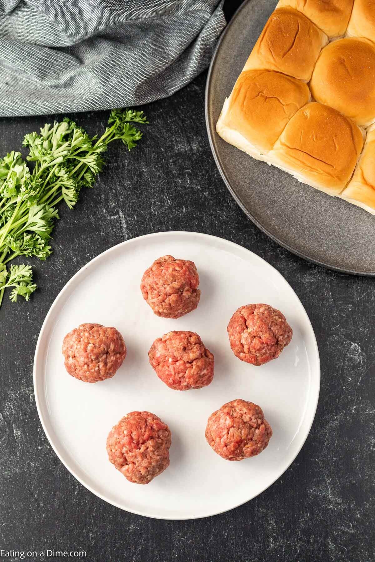 Plate with burgers ready for the grill or stove. 