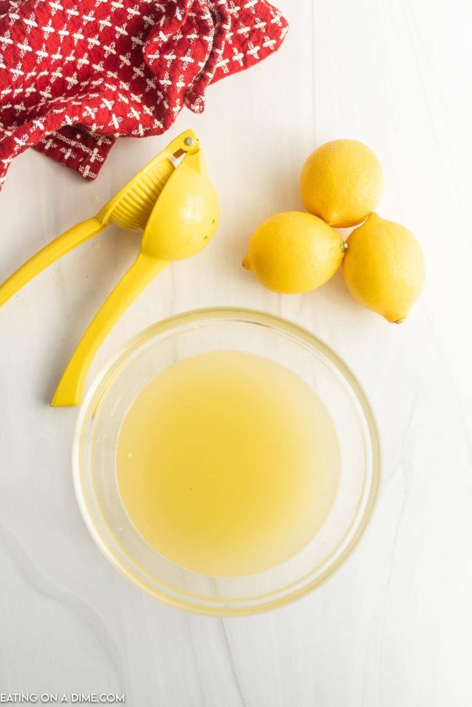 Squeezing lemons in a bowl