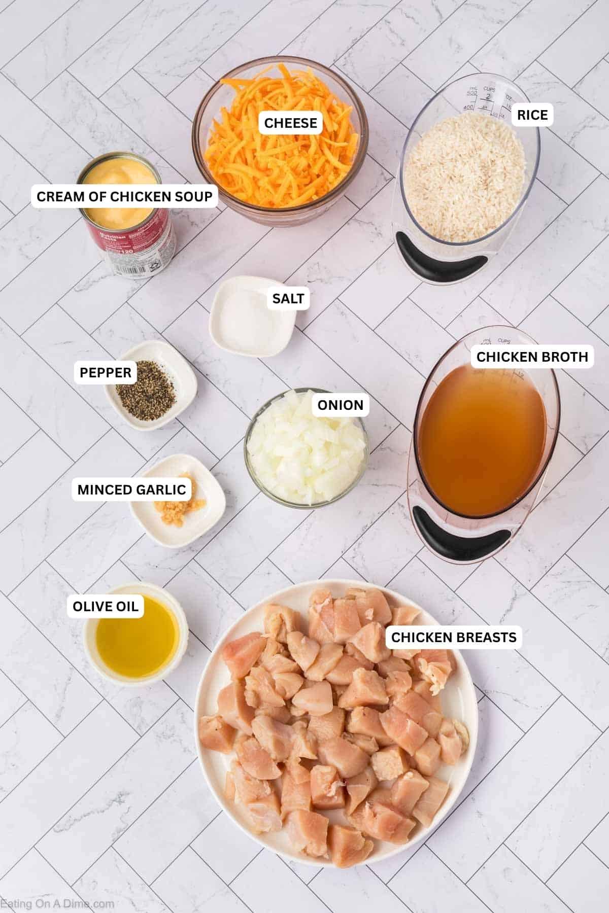 Ingredients for recipe: cream of chicken soup, cheese, rice, salt, pepper, onion, chicken broth, minced garlic, olive oil and chicken breasts.
