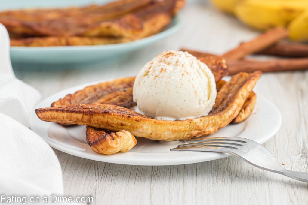 Air Fried bananas on a plate with a scoop of ice cream