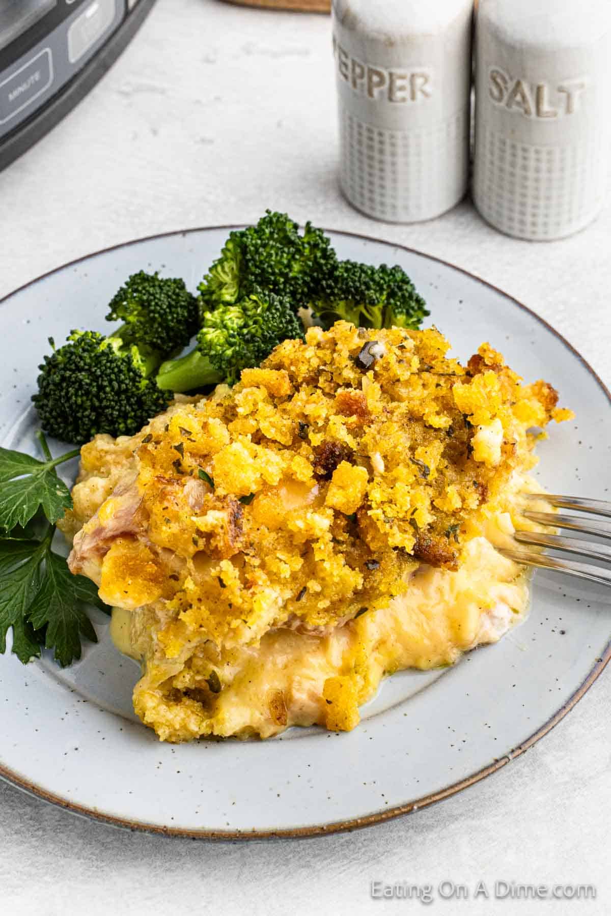 Chicken cordon bleu on a plate with broccoli