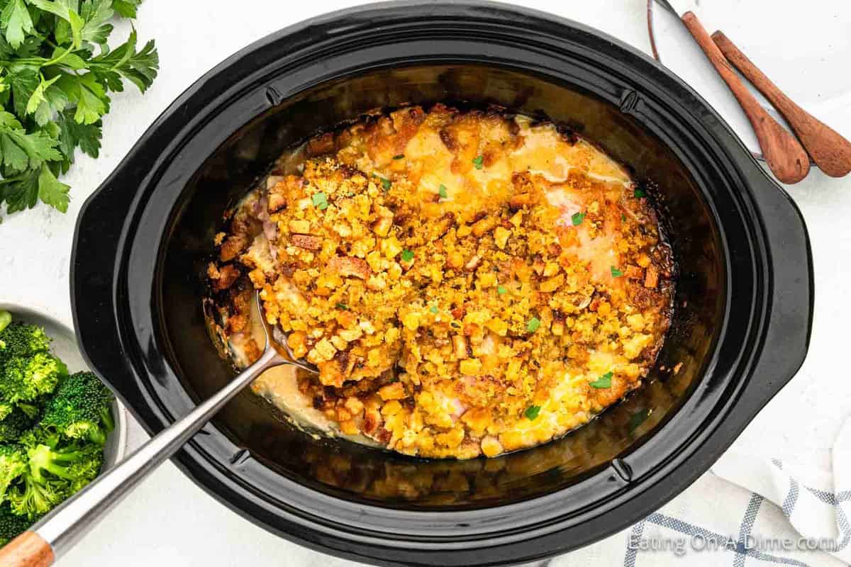 Chicken Cordon Bleu in the crockpot with a silver spoon