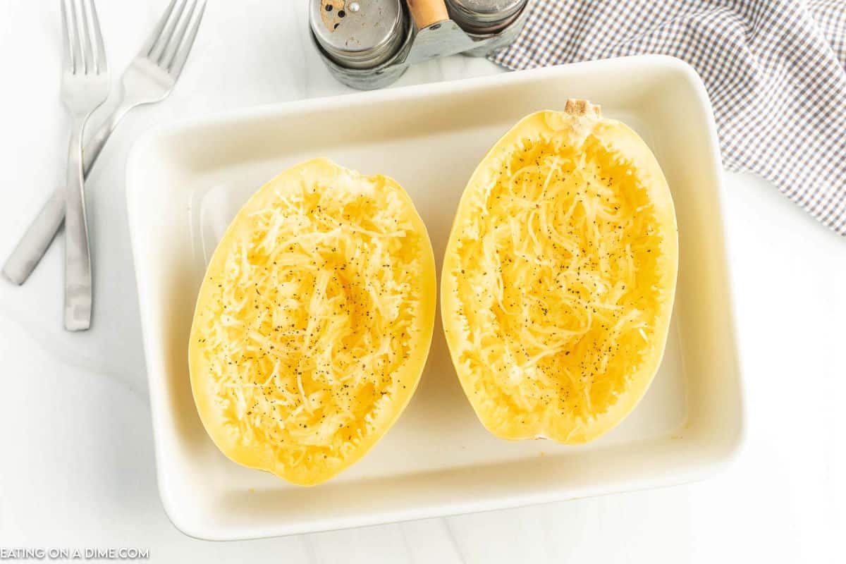 Cooked spaghetti squash in a baking dish.