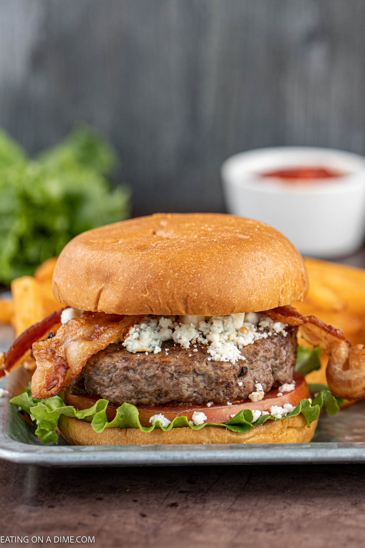 Bacon blue cheese burger on a plate. 