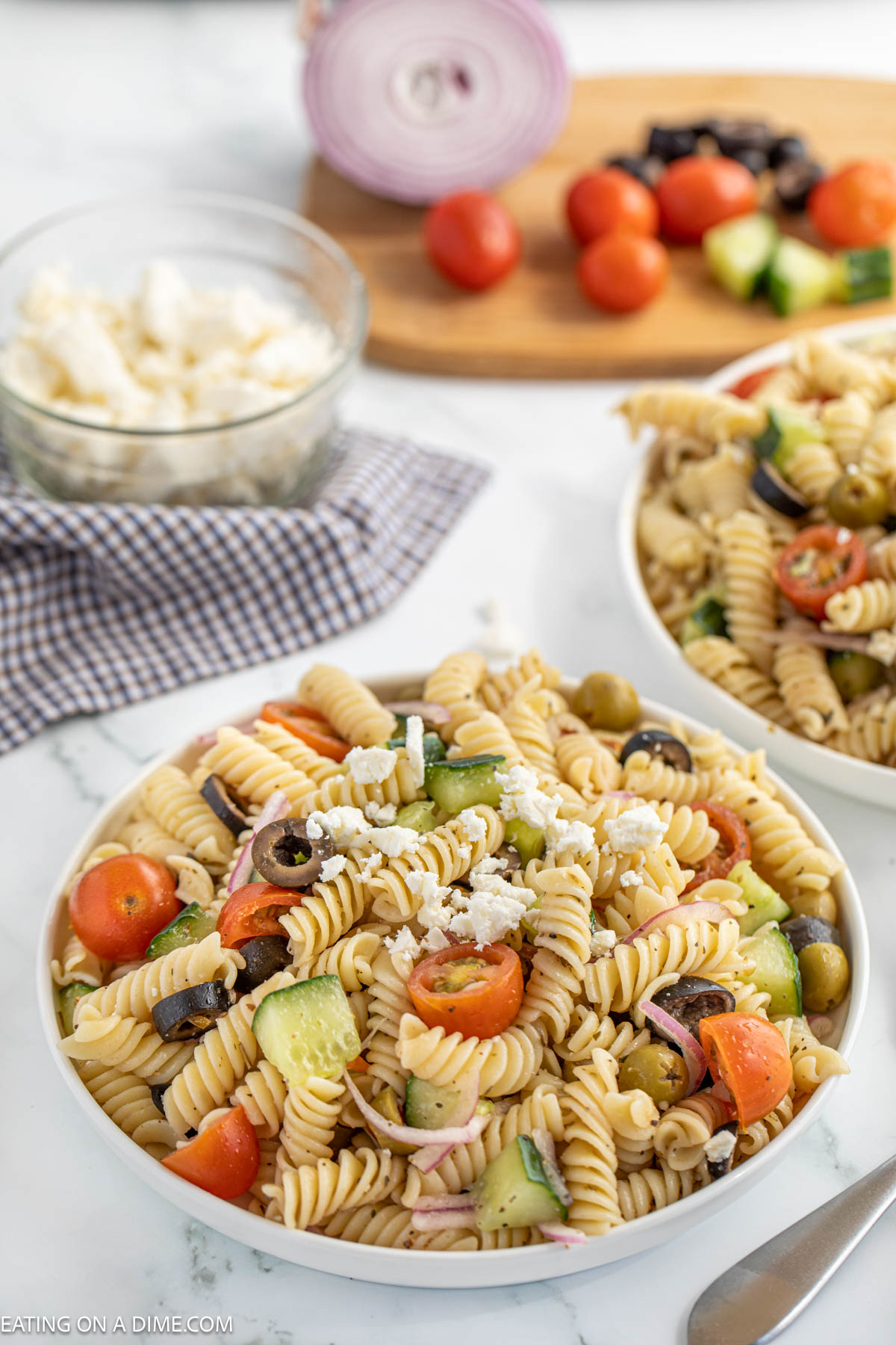 Mediterranean Pasta Salad in a bowl topped with feta cheese