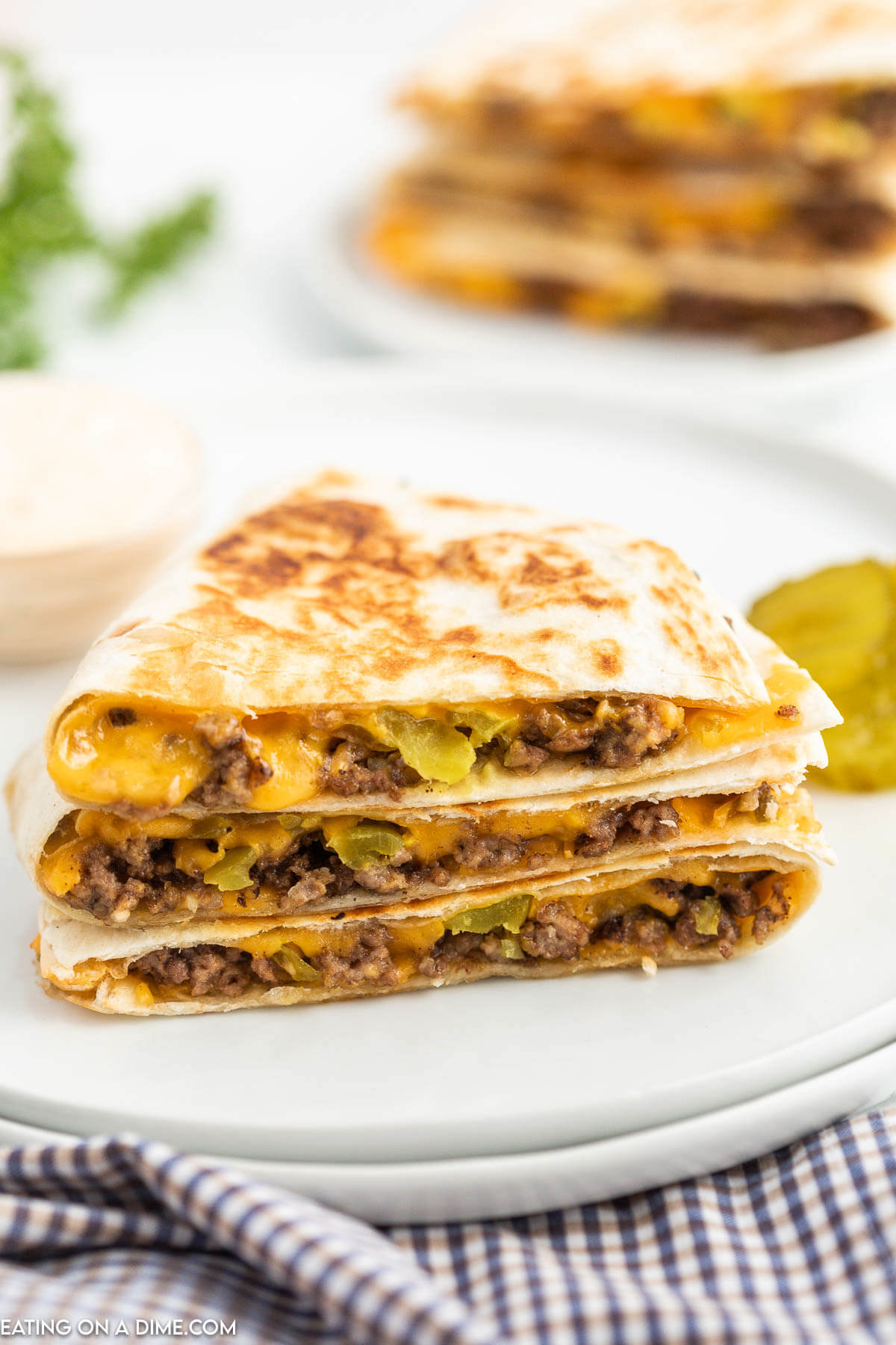 Cheeseburger Quesadilla stacked on a plate