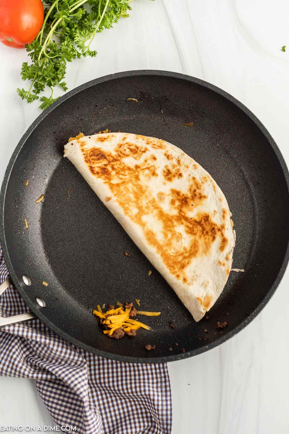 Cooking quesadilla in a skillet